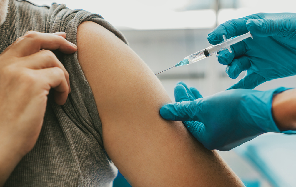 administering the covid-19 vaccine to an essential worker
